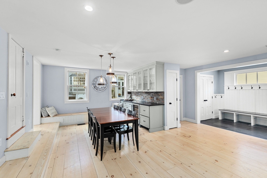 132 Main Street Hingham, MA 02043 - Photo 5 of 42 a living room with furniture a dining table and kitchen view