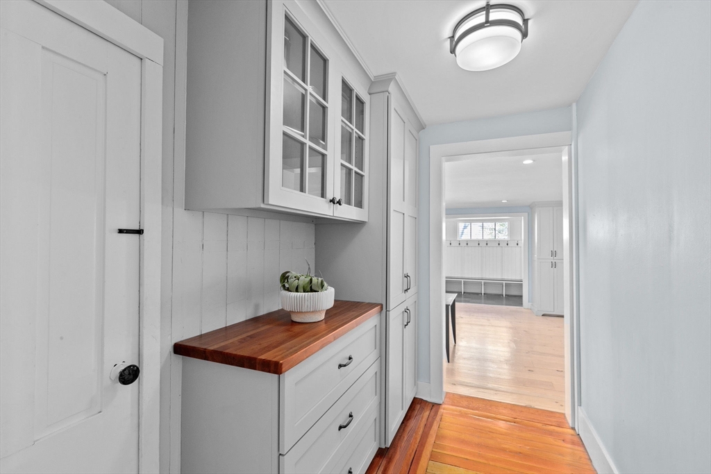 132 Main Street Hingham, MA 02043 - Photo 6 of 42 a hallway with cabinets
