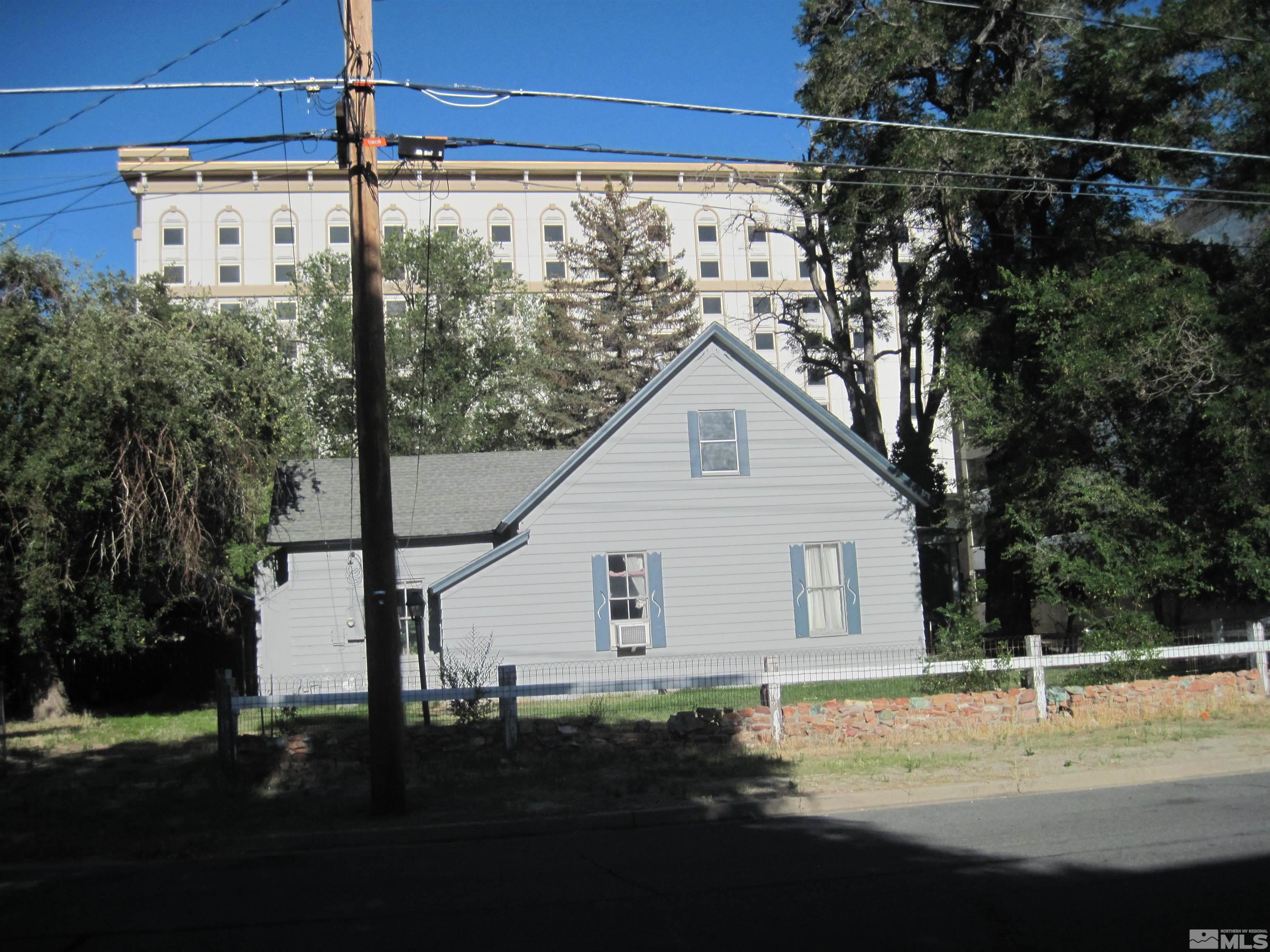 Undisclosed Address Carson City, NV 89703 - Photo 3 of 13 a view of a house with backyard