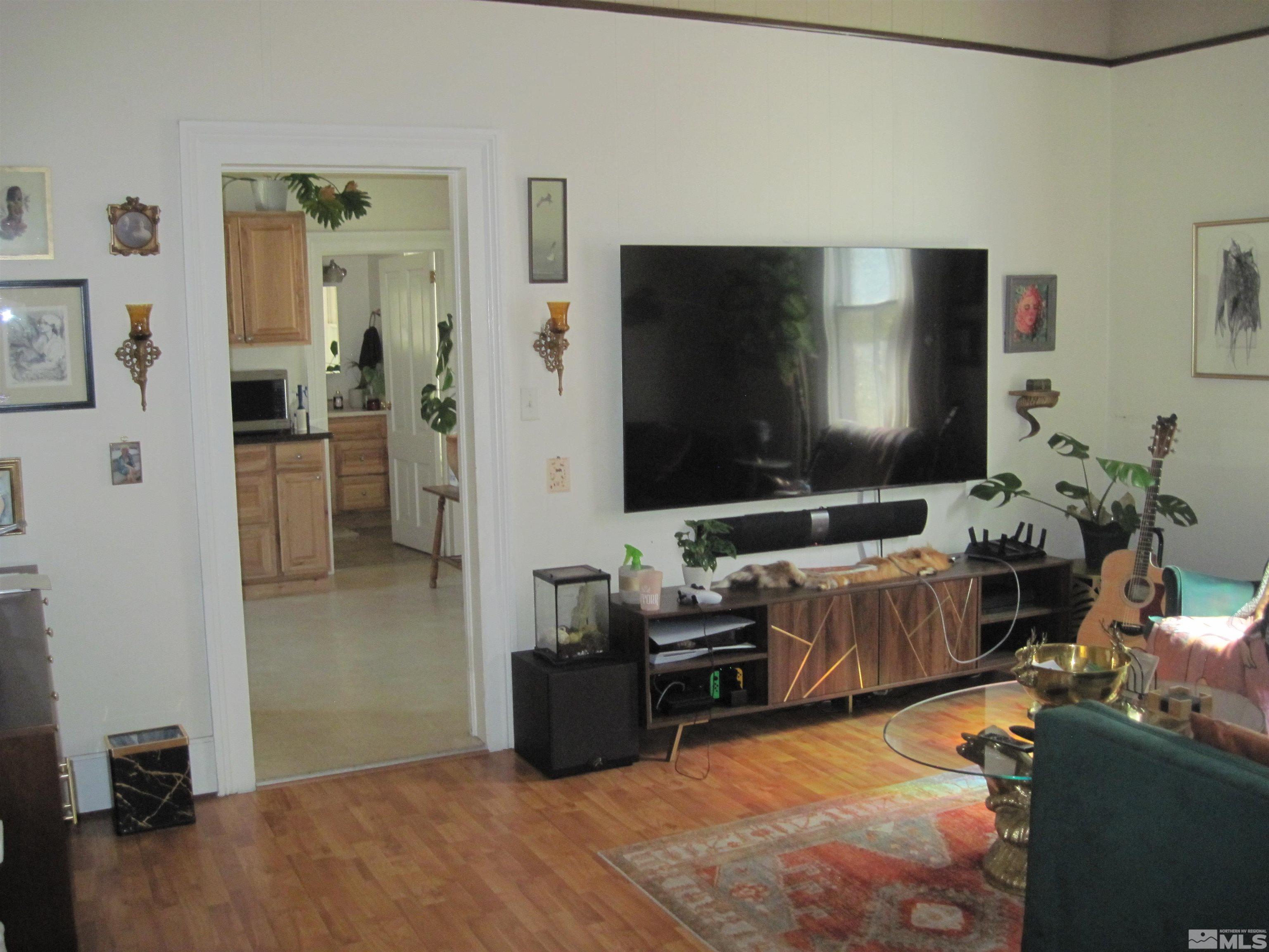 Undisclosed Address Carson City, NV 89703 - Photo 6 of 13 a living room with furniture and a flat screen tv
