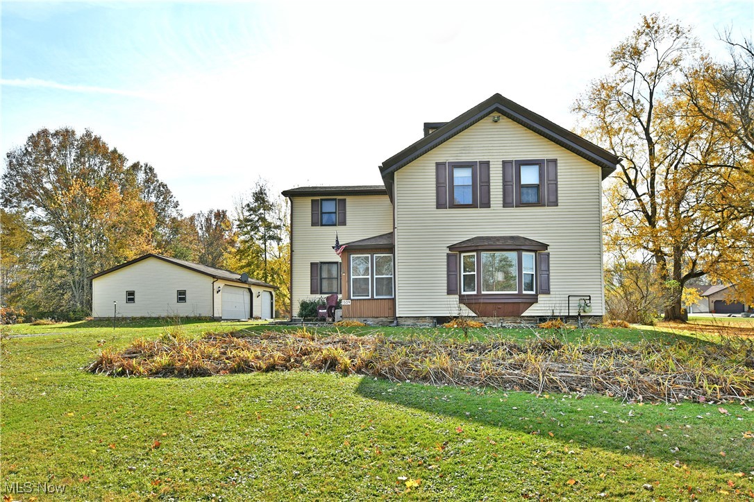 1509 State Road Northwest Warren, OH 44481 - Photo 1 of 49 Rear view of property featuring a yard