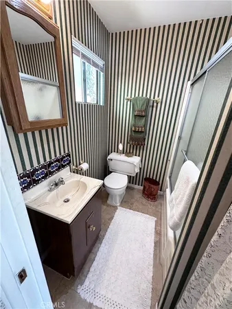 a view of a hallway with furniture