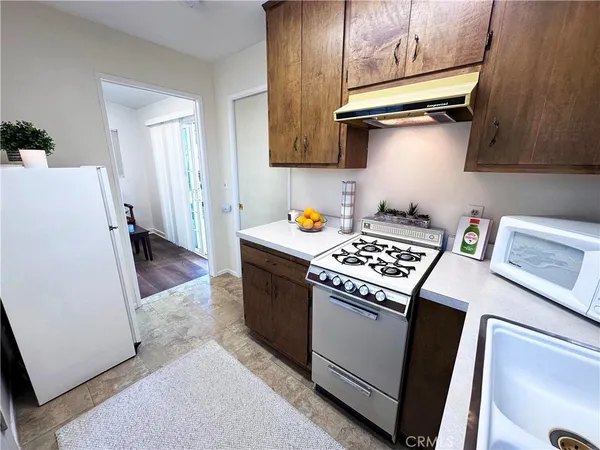 a kitchen with a stove and a microwave