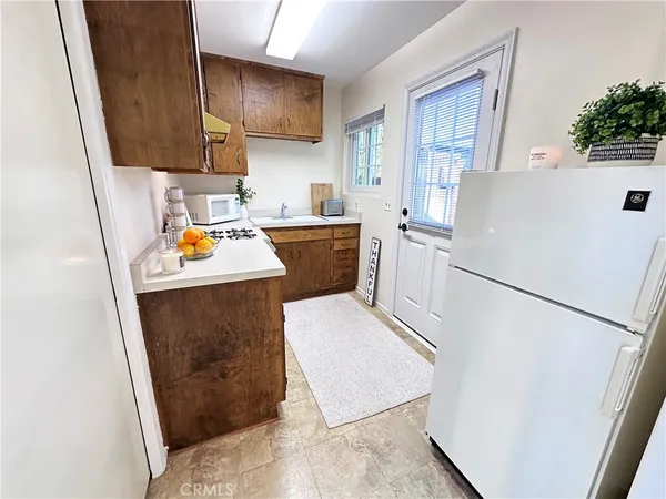 a utility room with sink a washer and dryer