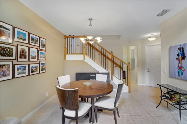 a dining room with furniture and entryway