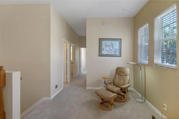 a living room with furniture and a chair