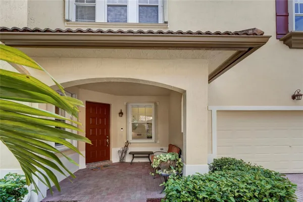 a view of a balcony with potted plants