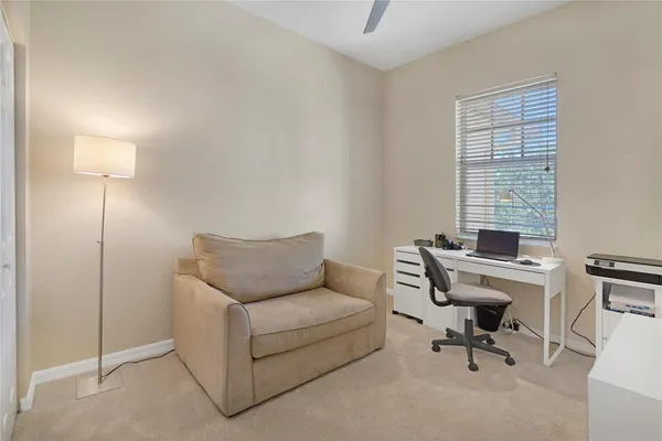 a work room with furniture and a window