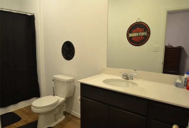 a bedroom with a bed and cabinets