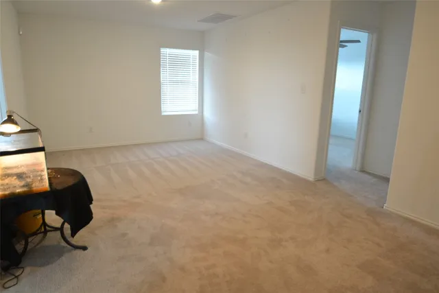 a bathroom with a toilet and a mirror