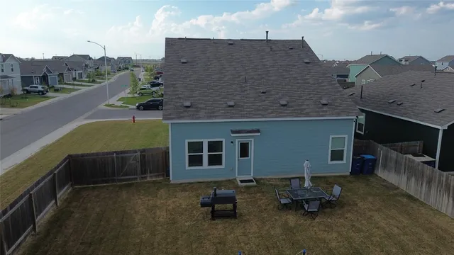 a aerial view of a house with sitting area and furniture