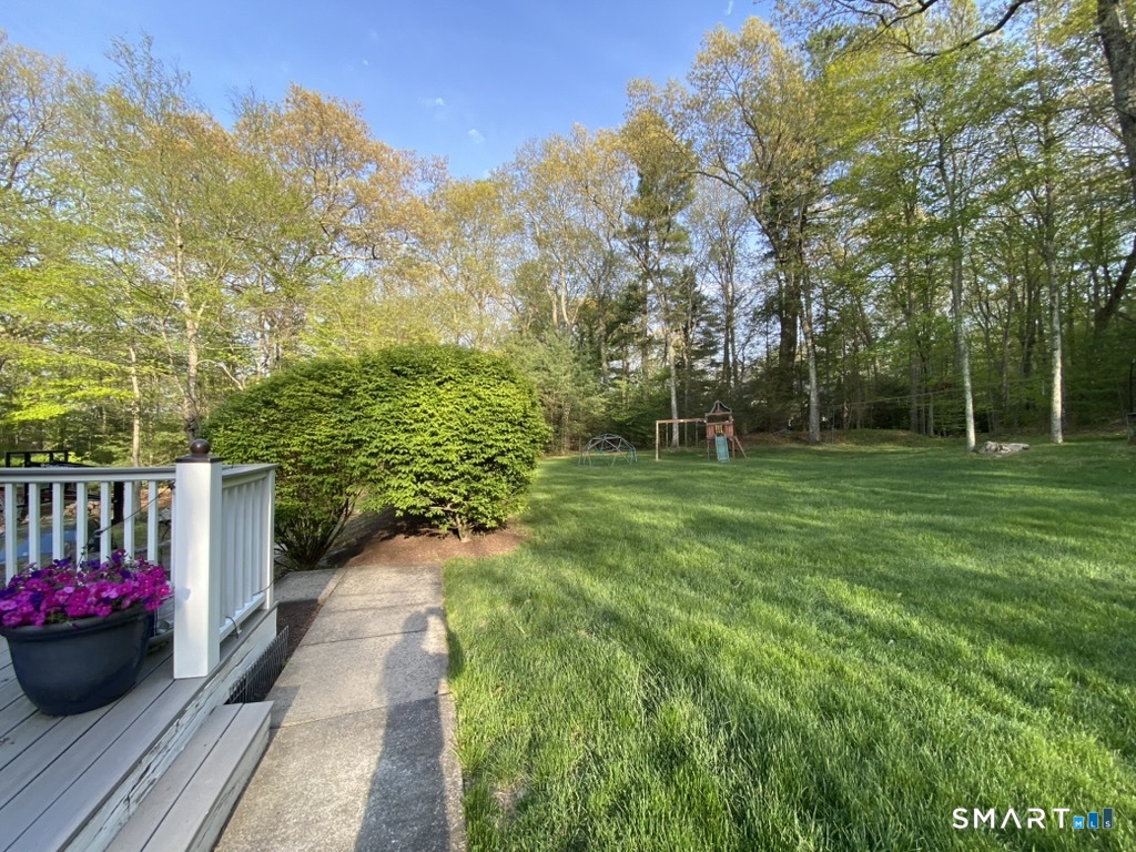 12 Carriage Hill Road Woodbridge, CT 06525 - Photo 5 of 24 a view of a garden with a flower garden