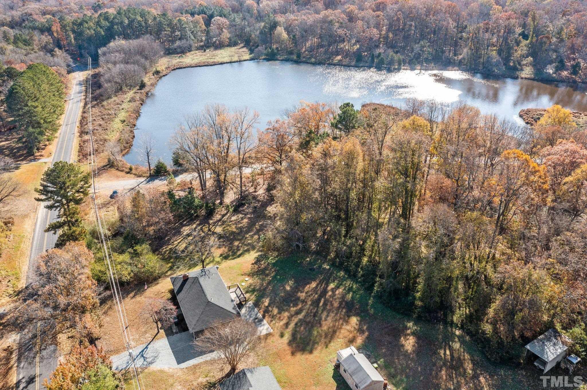 a view of a lake in middle of the forest