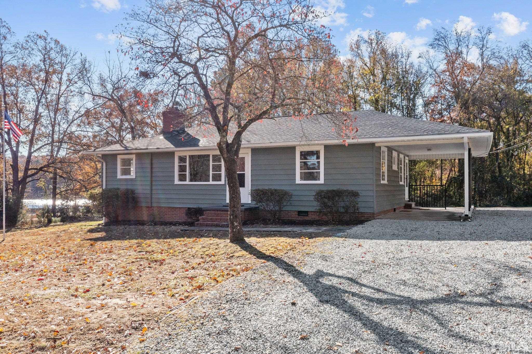 908 Goodwin Road Durham, NC 27712 - Photo 2 of 22 a front view of a house with a yard covered with snow
