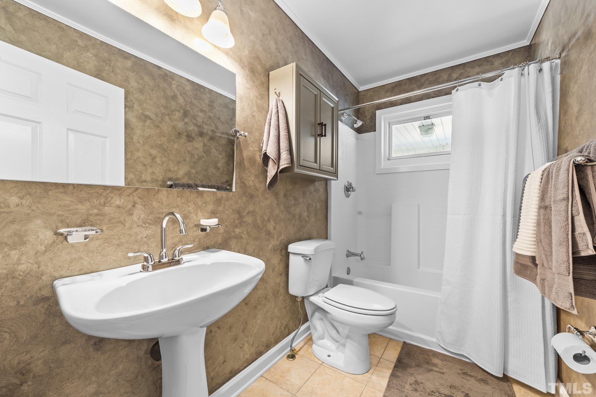 908 Goodwin Road Durham, NC 27712 - Photo 14 of 22 a bathroom with a toilet sink and a mirror