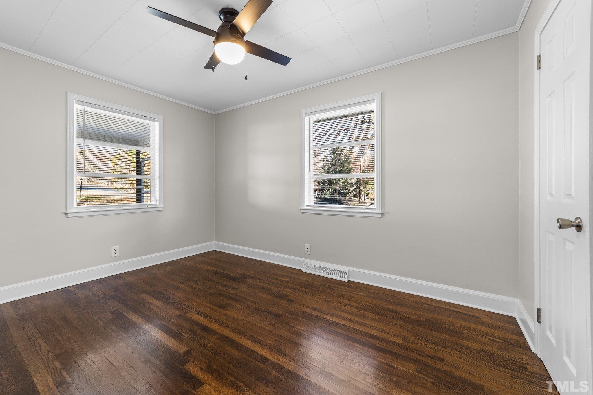 908 Goodwin Road Durham, NC 27712 - Photo 15 of 22 a view of empty room with wooden floor and fan