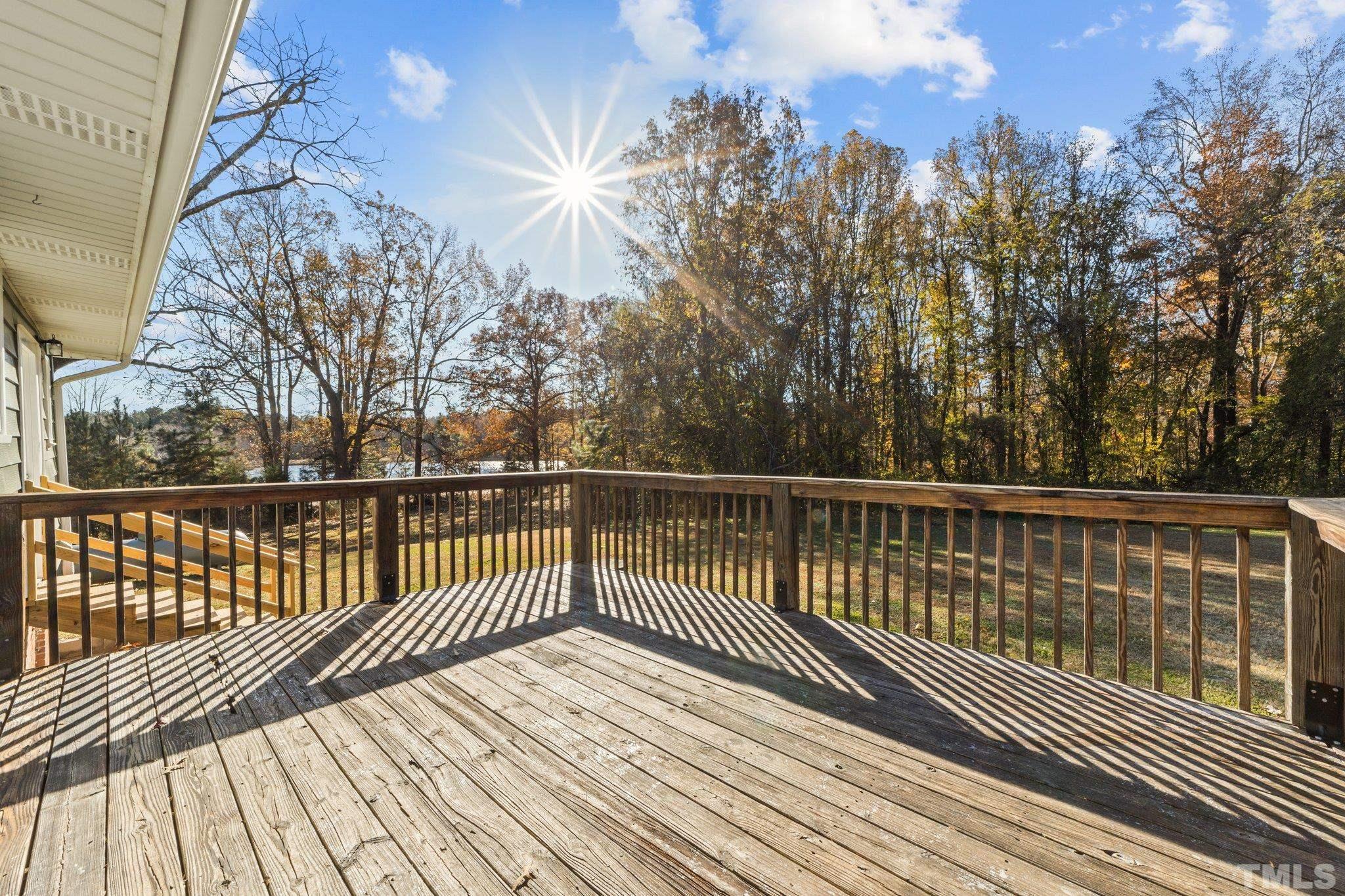 908 Goodwin Road Durham, NC 27712 - Photo 21 of 22 a view of balcony with wooden floor and fence