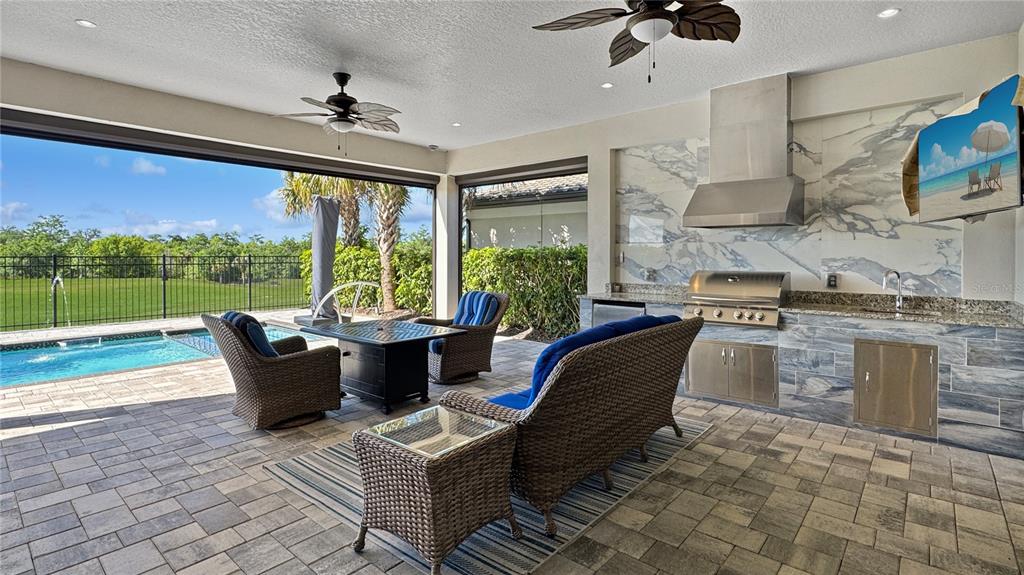 7948 Jacks Clb Drive Reunion, FL 34747 - Photo 11 of 85 a living room with furniture and a floor to ceiling window