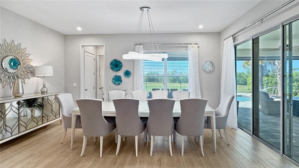 7948 Jacks Clb Drive Reunion, FL 34747 - Photo 25 of 85 a view of a dining room with furniture window and wooden floor