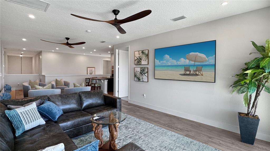 7948 Jacks Clb Drive Reunion, FL 34747 - Photo 31 of 85 a living room with furniture and a potted plant