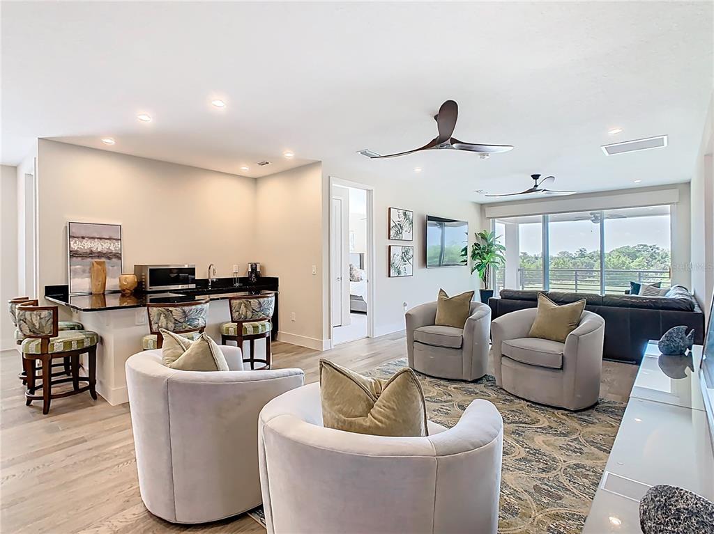 7948 Jacks Clb Drive Reunion, FL 34747 - Photo 36 of 85 a living room with furniture and a large window