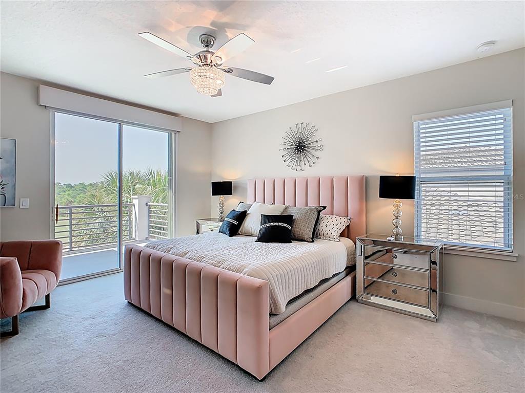 7948 Jacks Clb Drive Reunion, FL 34747 - Photo 49 of 85 a bedroom with a bed couch and window