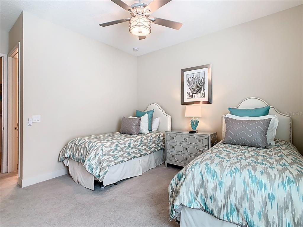 7948 Jacks Clb Drive Reunion, FL 34747 - Photo 55 of 85 a bedroom with two beds and painting on the wall