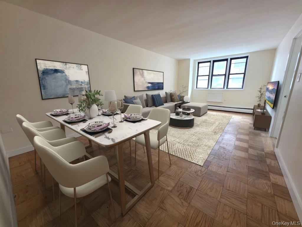a dining room with furniture and a large window
