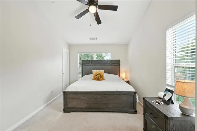 a bedroom with a bed and window