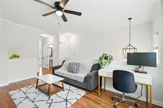 a workspace with furniture and a wooden floor