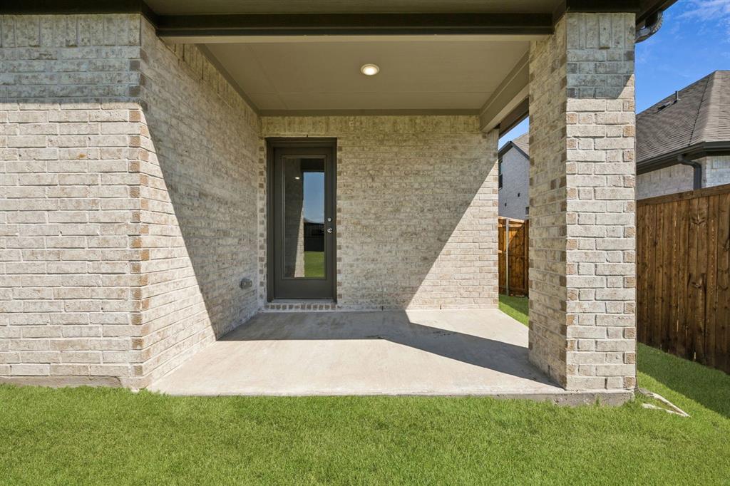 5721 Rushing River Way McKinney, TX 75071 - Photo 26 of 29 Covered Patio in the Heisman home plan by Trophy Signature Homes – REPRESENTATIVE PHOTO
