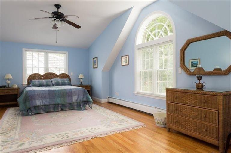 414 Eel River Road Osterville, MA 02655 - Photo 11 of 23 a bedroom with a bed and a chandelier