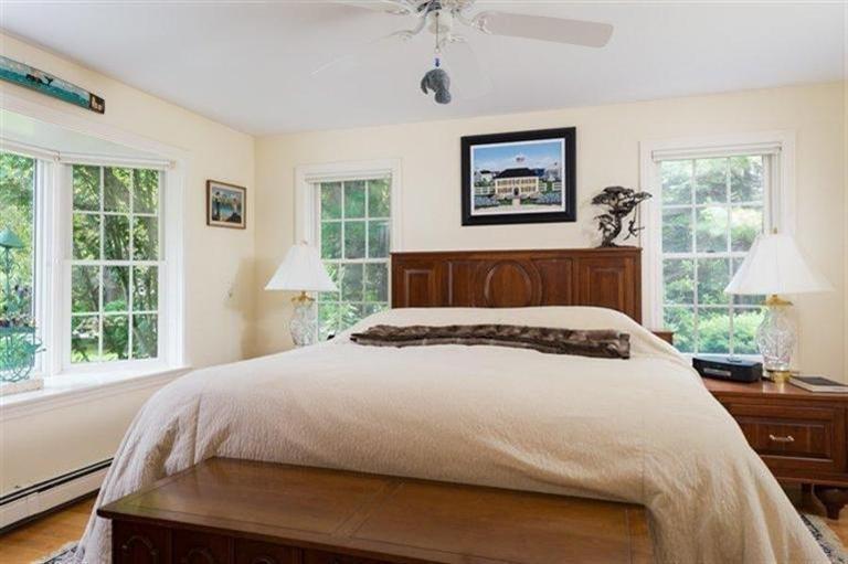 414 Eel River Road Osterville, MA 02655 - Photo 13 of 23 a bedroom with a large bed and a window