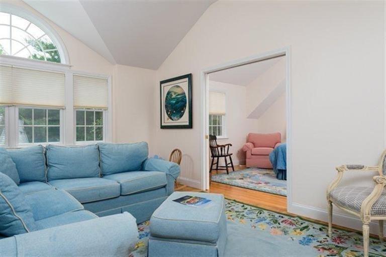 414 Eel River Road Osterville, MA 02655 - Photo 14 of 23 a living room with furniture and a floor to ceiling window
