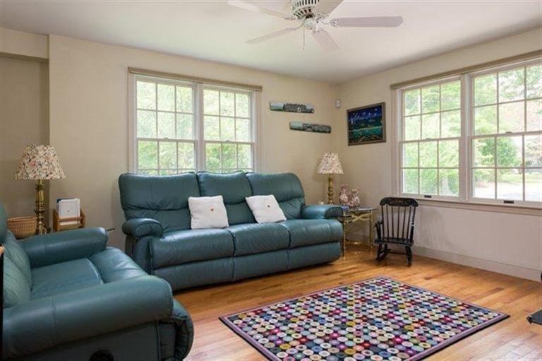 414 Eel River Road Osterville, MA 02655 - Photo 15 of 23 a living room with furniture and a rug