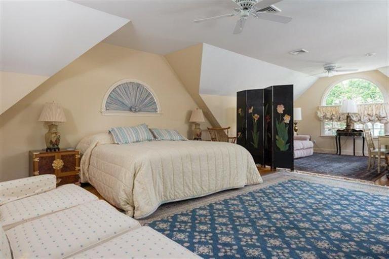 414 Eel River Road Osterville, MA 02655 - Photo 17 of 23 a bedroom with bed and a chandelier