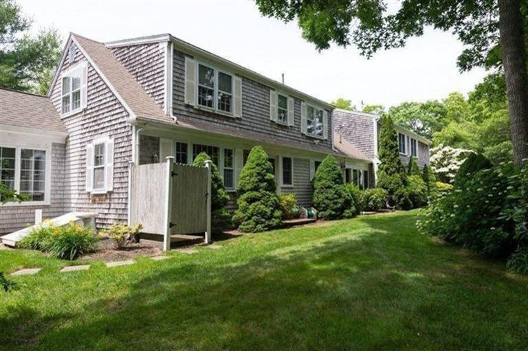 414 Eel River Road Osterville, MA 02655 - Photo 21 of 23 a front view of a house with a yard