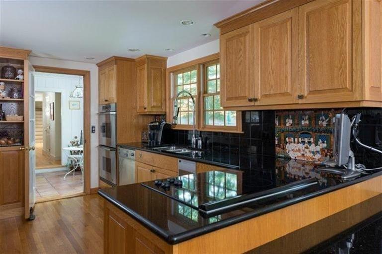 414 Eel River Road Osterville, MA 02655 - Photo 3 of 23 a kitchen with stainless steel appliances granite countertop a refrigerator and a stove