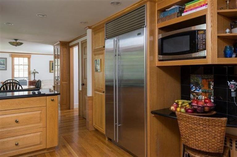 414 Eel River Road Osterville, MA 02655 - Photo 4 of 23 a kitchen with a refrigerator and microwave