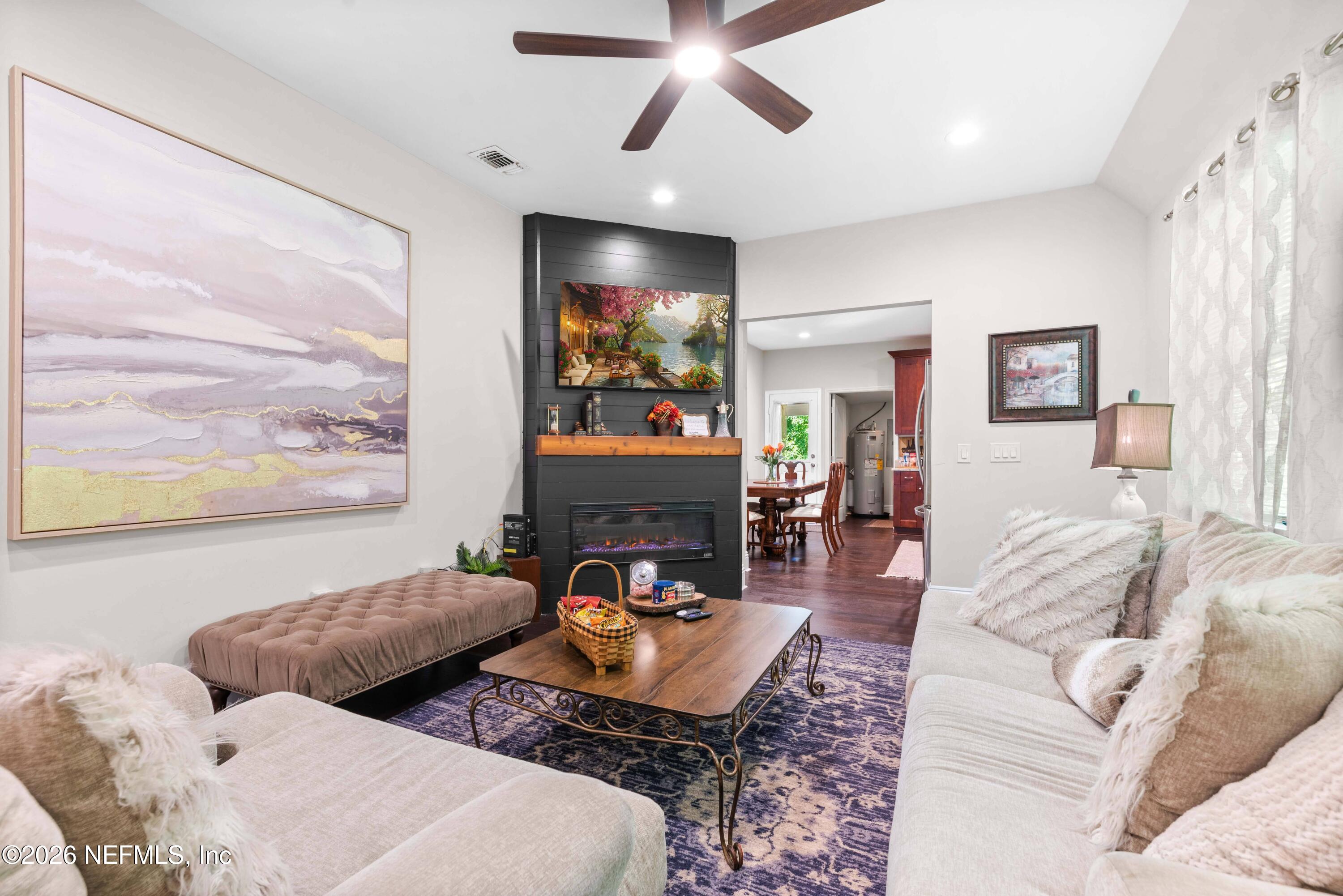 1138 Walnut Street Jacksonville, FL 32206 - Photo 22 of 37 a living room with furniture and a flat screen tv