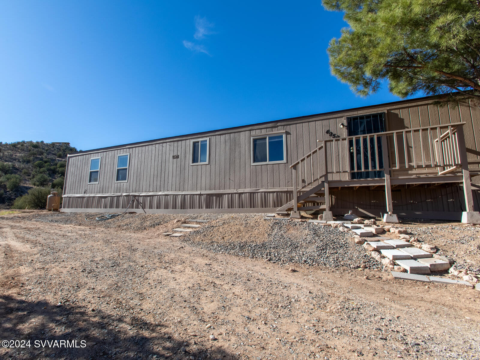 4950 Thunderhead Trail Rimrock, AZ 86335 - Photo 1 of 26 a backyard of a house with wooden deck