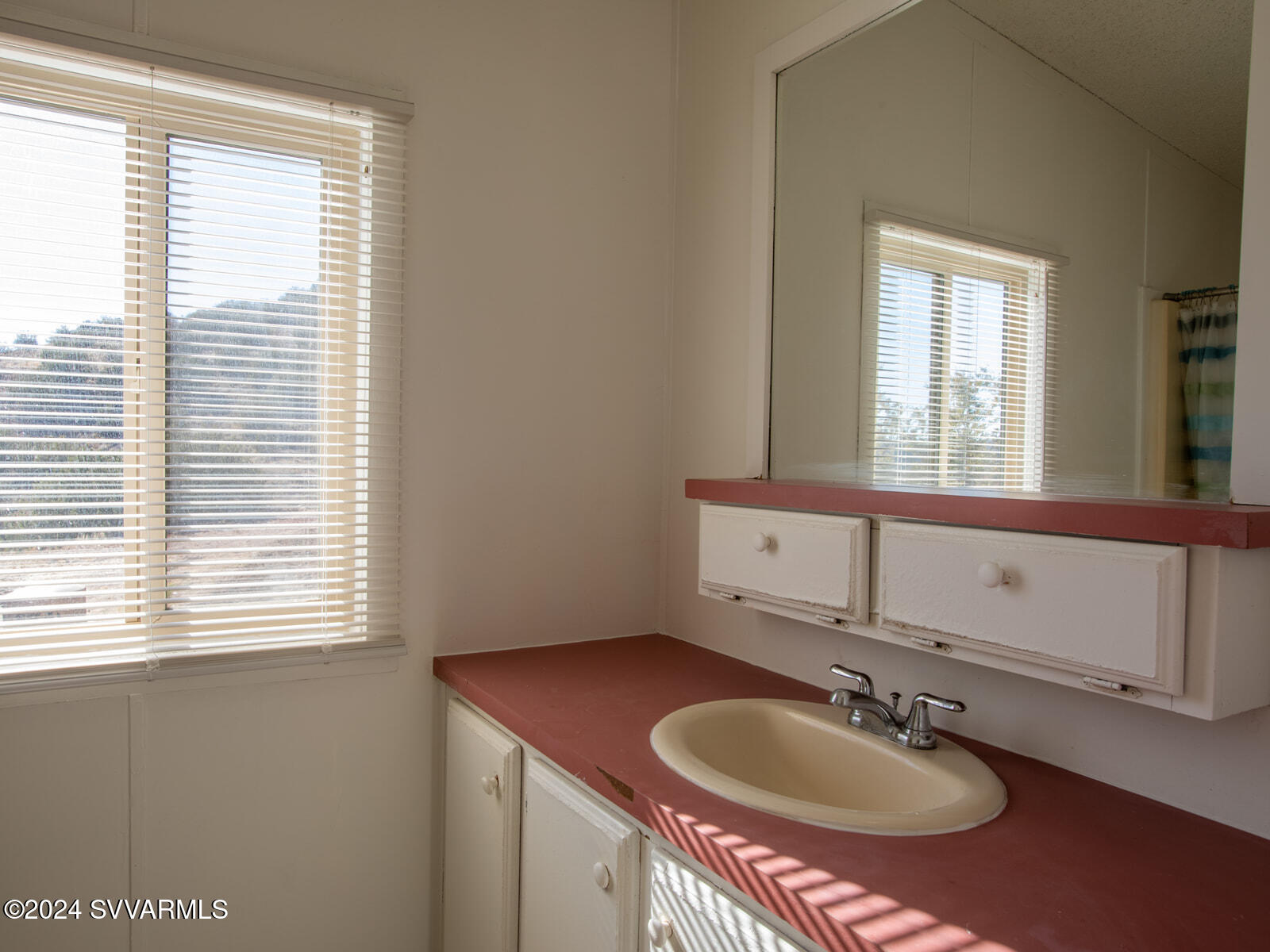 4950 Thunderhead Trail Rimrock, AZ 86335 - Photo 12 of 26 a bathroom with a sink and a mirror