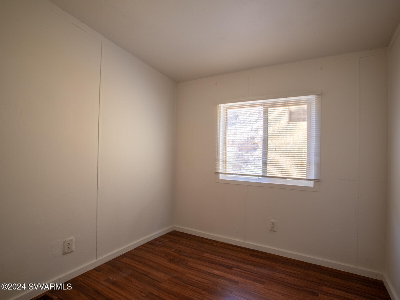 4950 Thunderhead Trail Rimrock, AZ 86335 - Photo 16 of 26 an empty room with wooden floor and windows