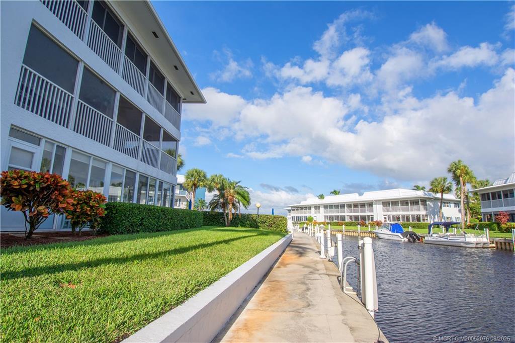 1866 Southwest Palm City Road, Unit 101 Stuart, FL 34994 - Photo 11 of 23 a view of building with garden