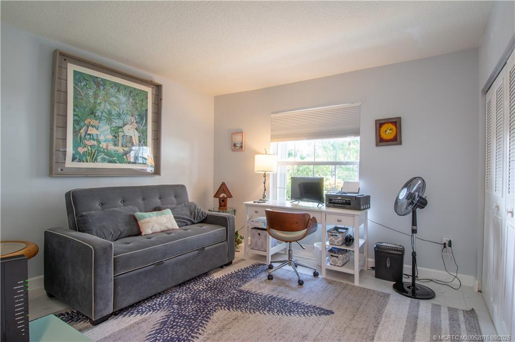 1866 Southwest Palm City Road, Unit 101 Stuart, FL 34994 - Photo 14 of 23 a living room with furniture and a window