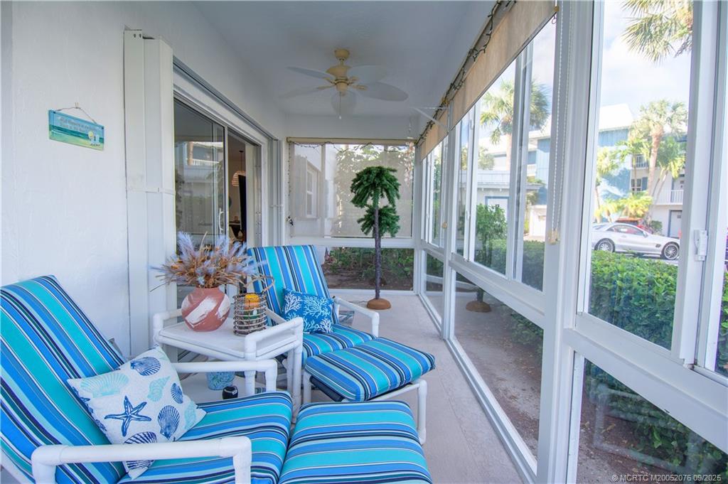 1866 Southwest Palm City Road, Unit 101 Stuart, FL 34994 - Photo 20 of 23 a living room with furniture and a large window