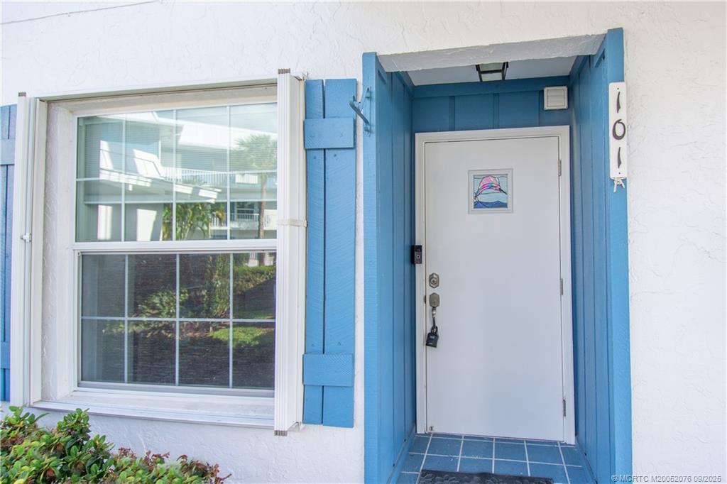 1866 Southwest Palm City Road, Unit 101 Stuart, FL 34994 - Photo 2 of 23 a view of front door of a house