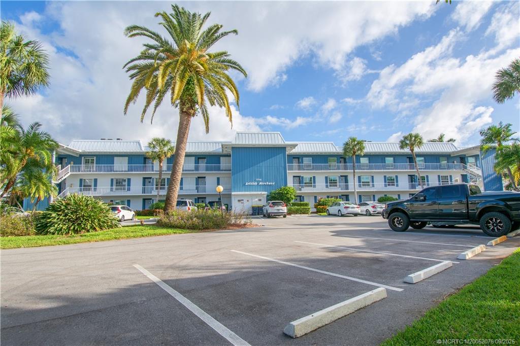 1866 Southwest Palm City Road, Unit 101 Stuart, FL 34994 - Photo 23 of 23 a front view of multiple houses with yard