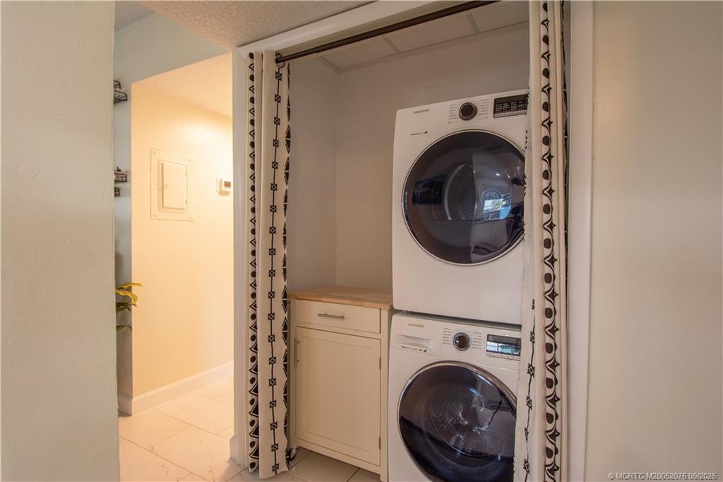 1866 Southwest Palm City Road, Unit 101 Stuart, FL 34994 - Photo 7 of 23 a utility room with dryer and washer