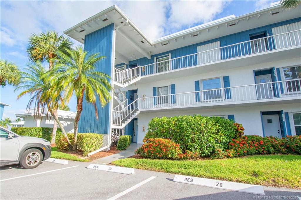 1866 Southwest Palm City Road, Unit 101 Stuart, FL 34994 - Photo 10 of 23 a front view of a house with garden